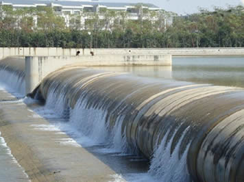 A black pillow-like rubber dam for water containment.