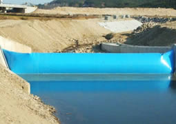 A blue pillow-like air filled rubber dam