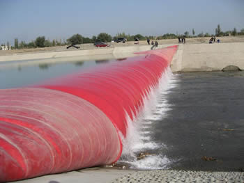 A red pillow-like air filled rubber dam