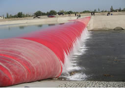 A red pillow-like air filled rubber dam